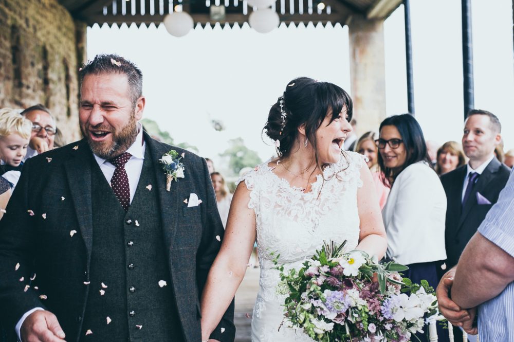 bride and groom in confetti matfen