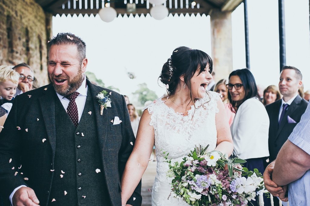 bride and groom in confetti matfen