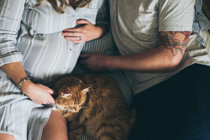 expectant mother with husband and cat