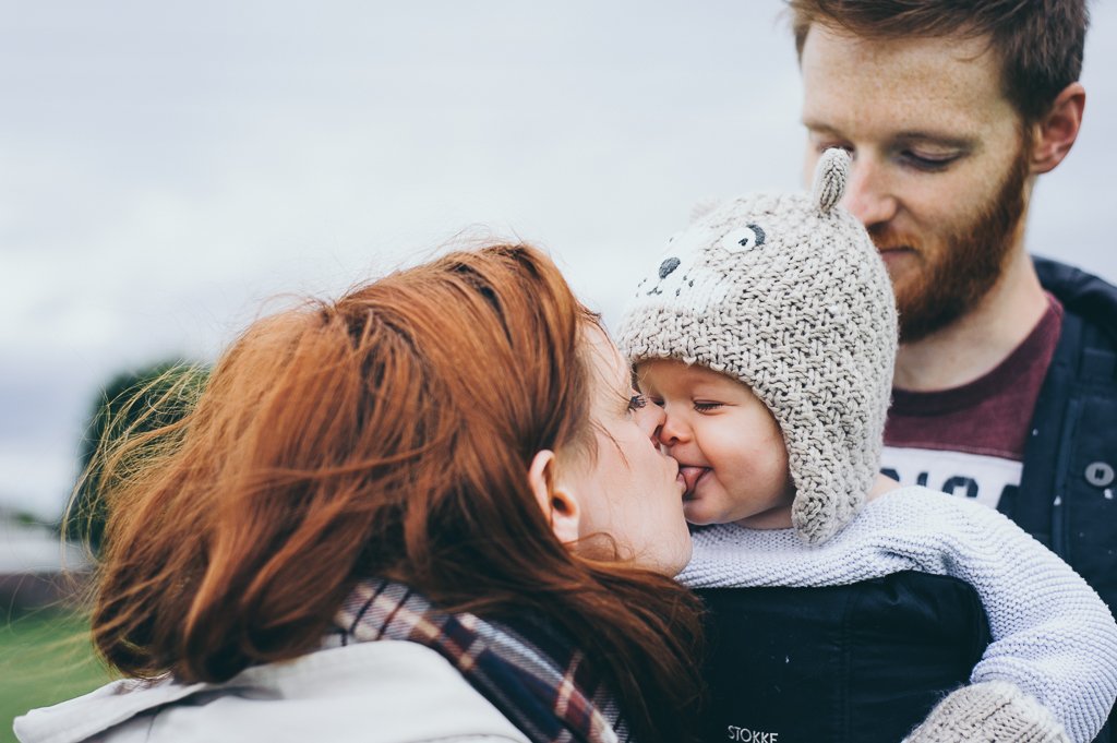 mummy kissing baby