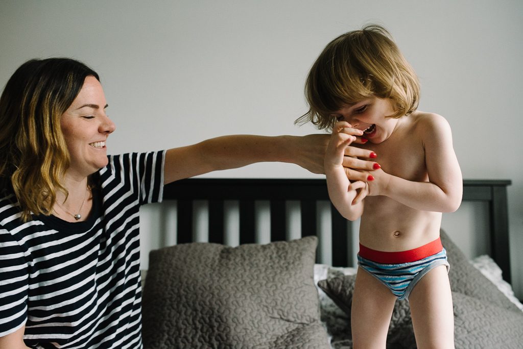 Tickling little boy