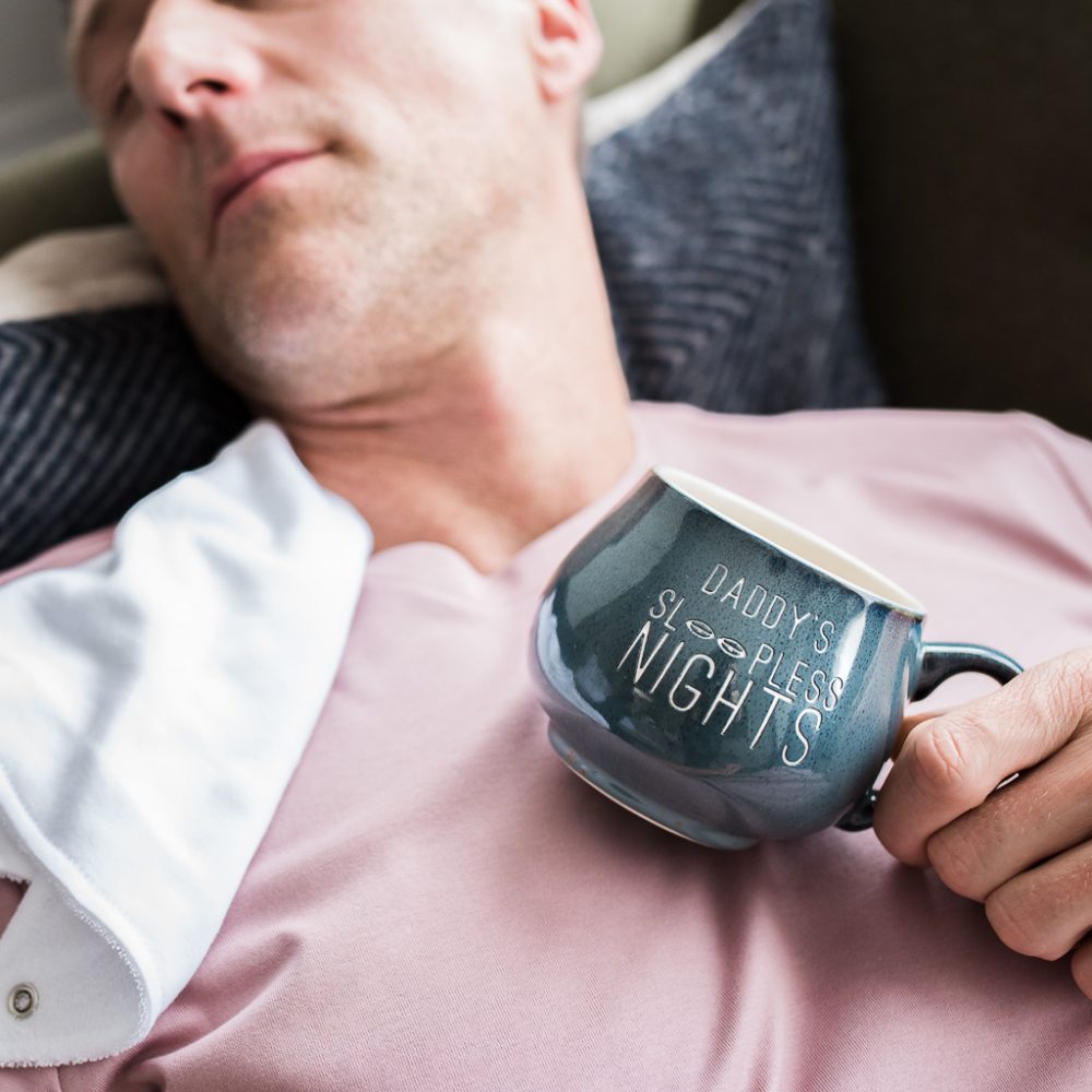 dad asleep holding mug