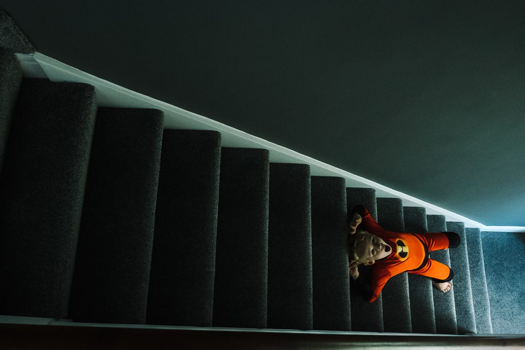 Incredibles boy slides down stairs