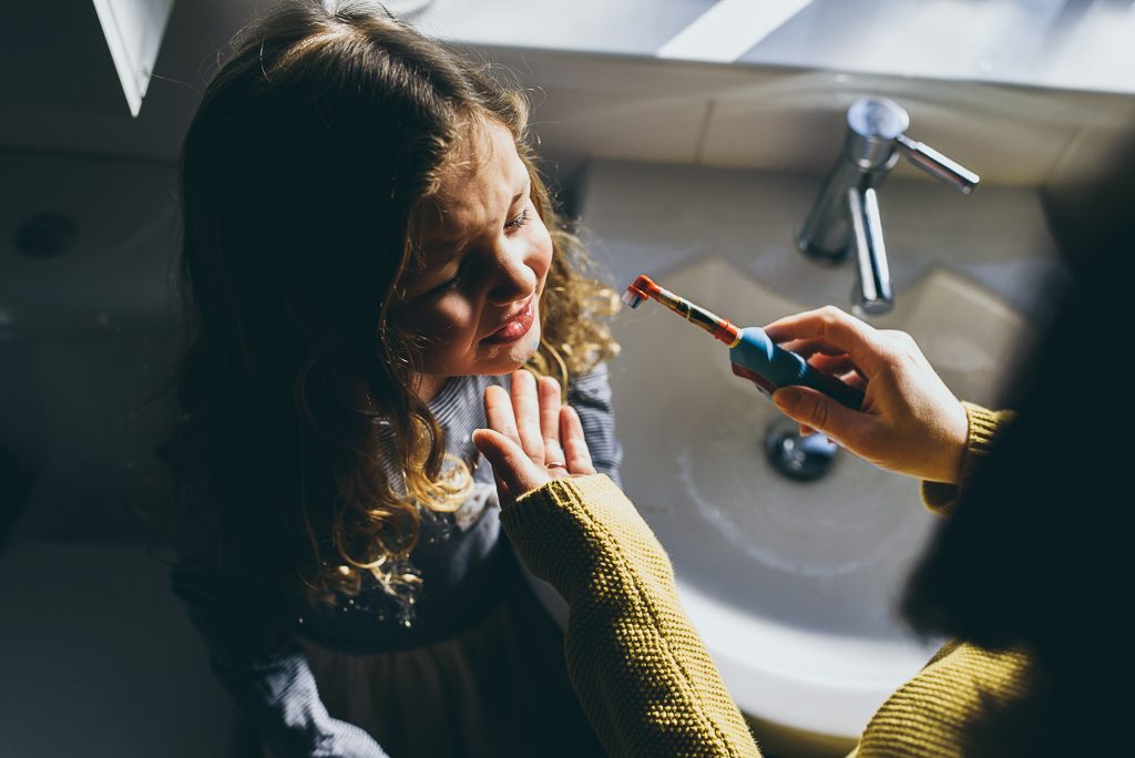 mum brushing teeth