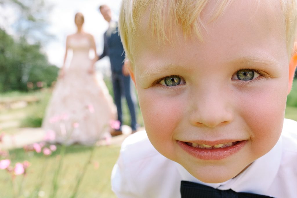 son photo bombs couple portrait