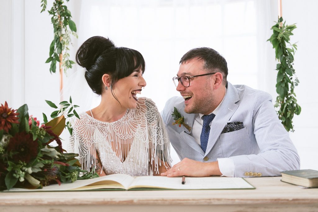 bride and groom laughing