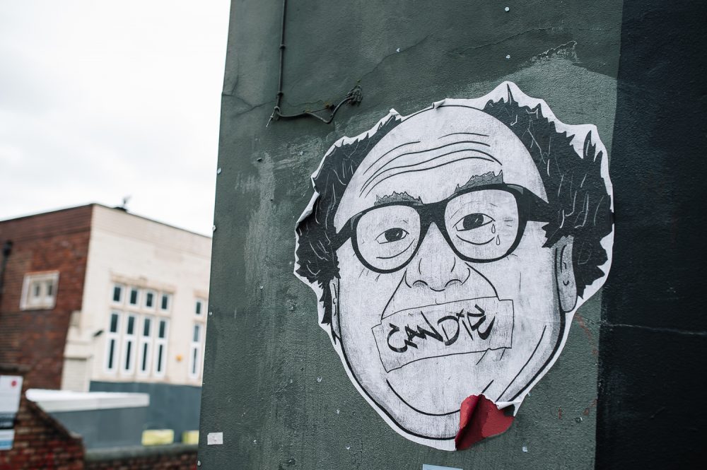 danny de vito on a wall