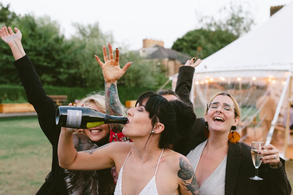 bride drinking from a bottle