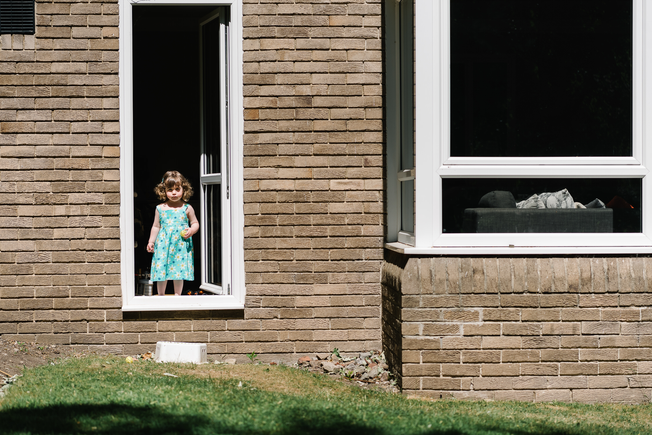Lockdown Stories little girl at back door