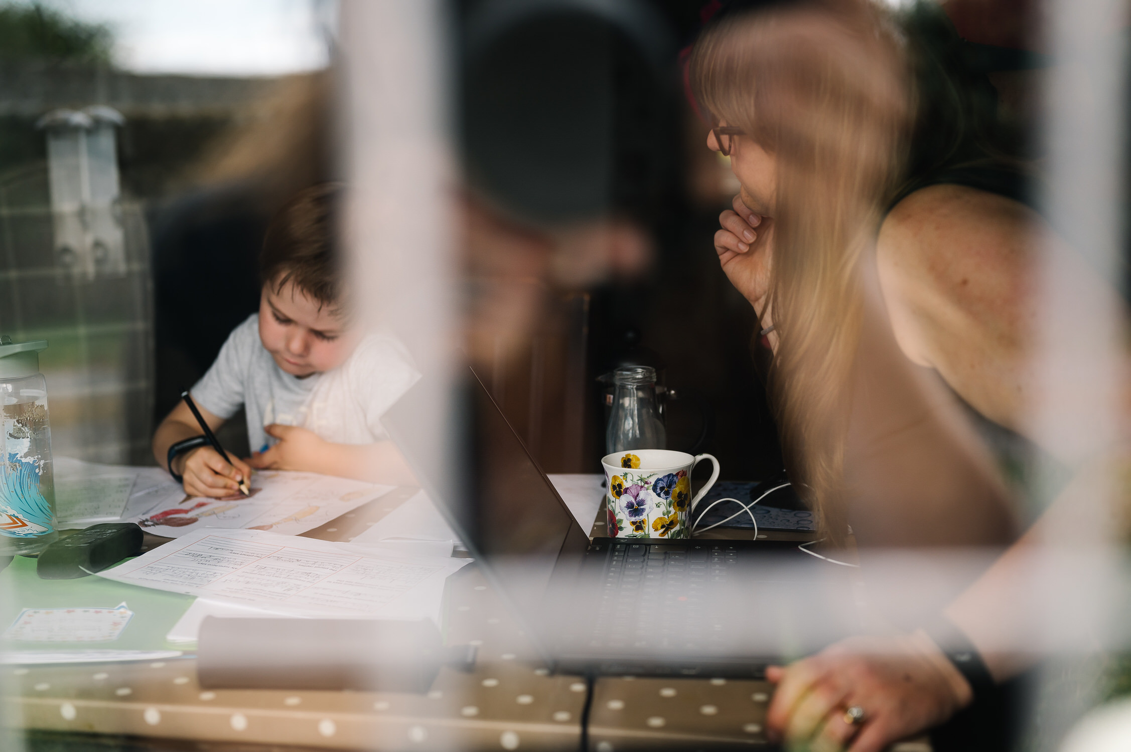 Mum helps boy with homeschooling during lockdown UK
