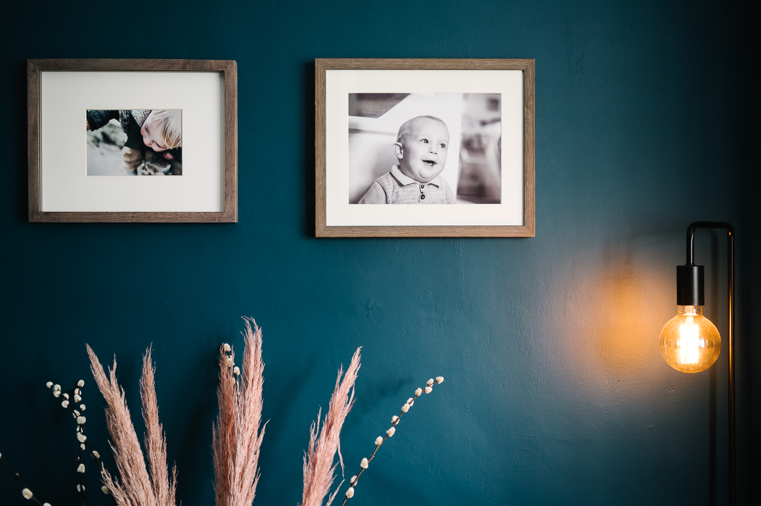 framed child photos on wall