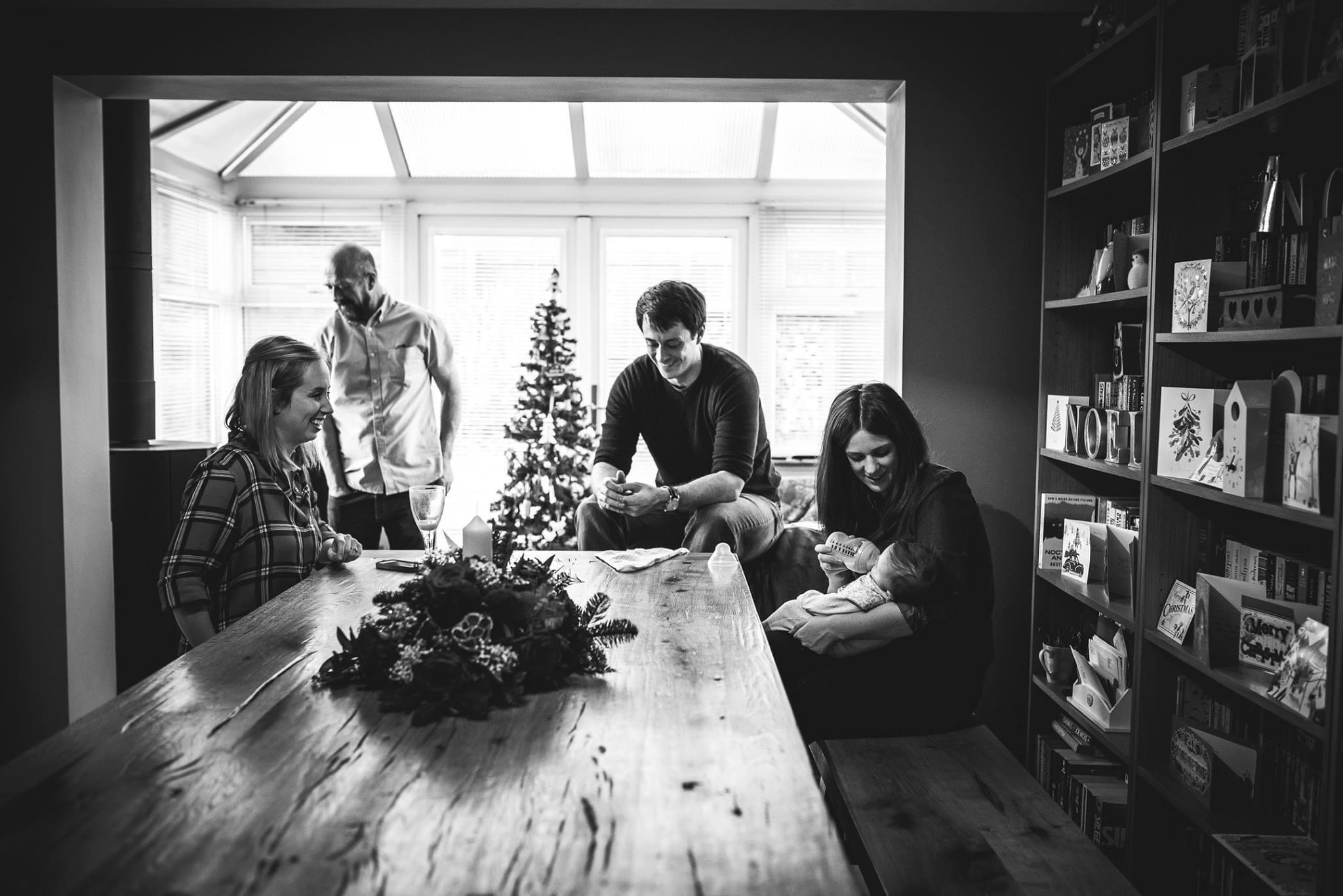 Family looking at newborn
