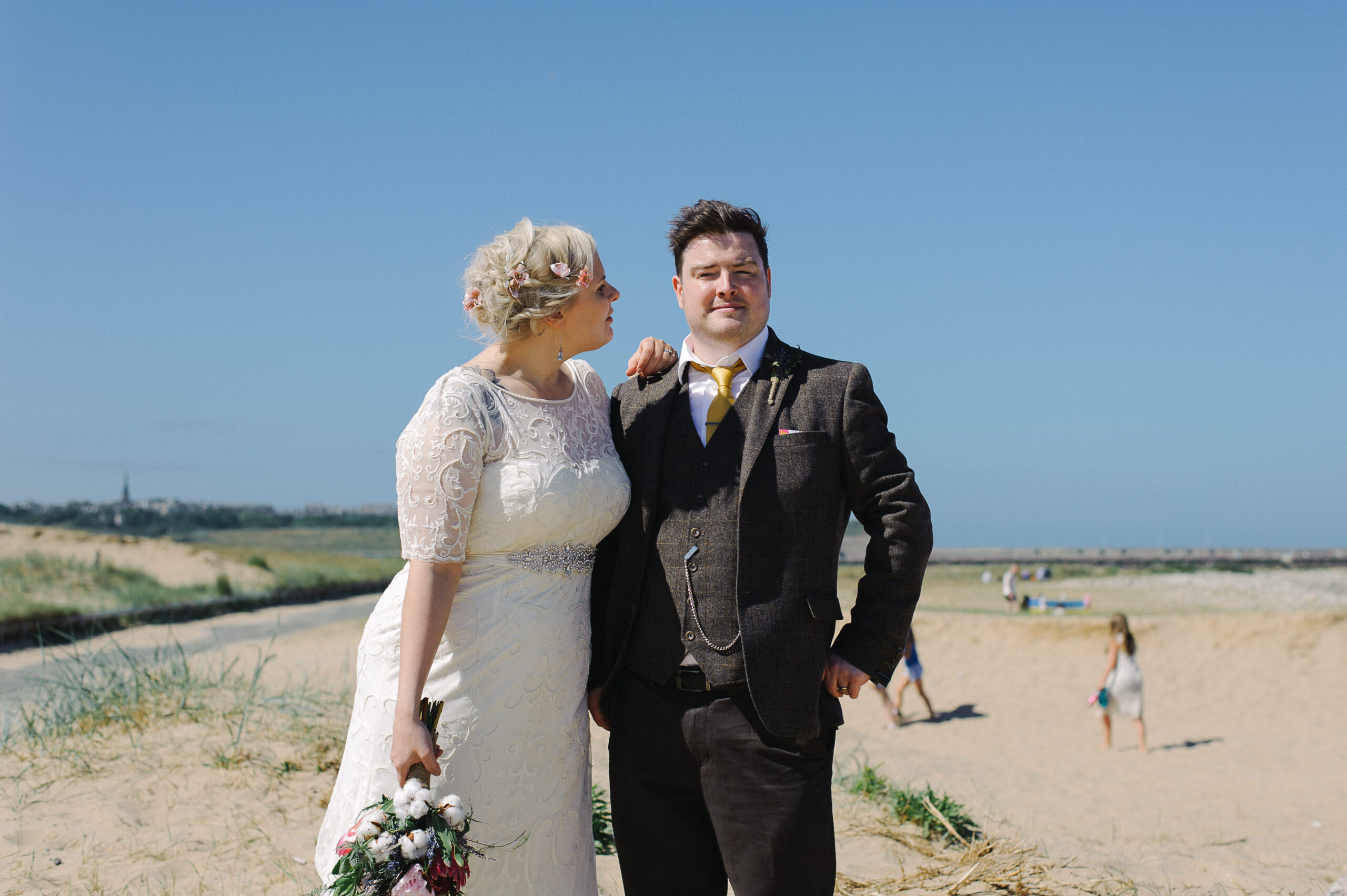 quirky seaside wedding bride and groom