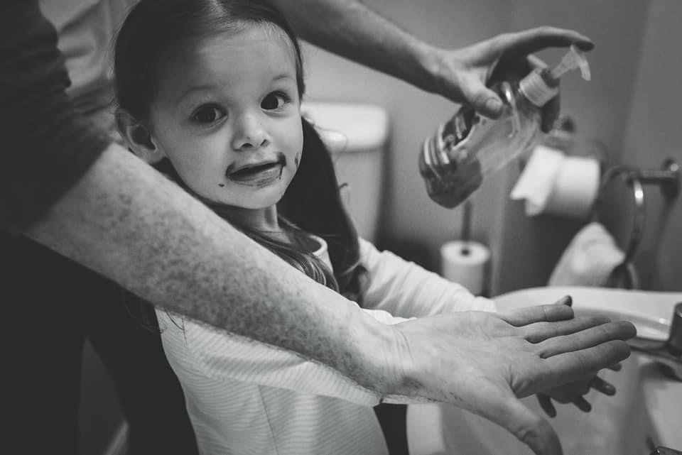 Little girl washing hands
