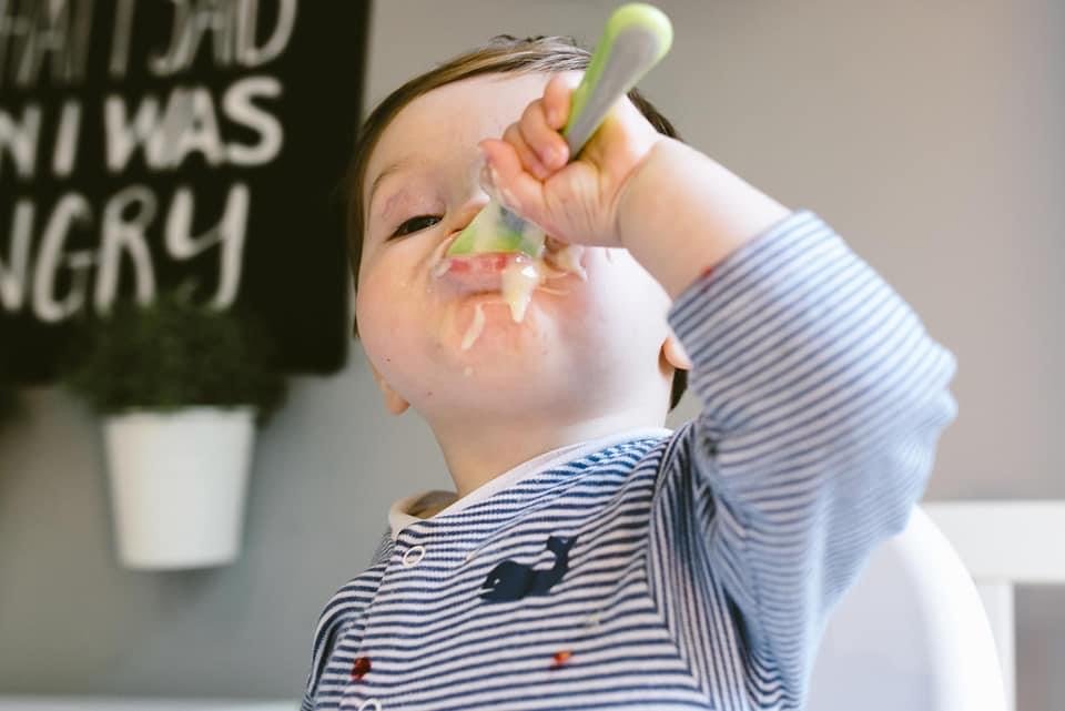 image17 Little boy feeds himself messily