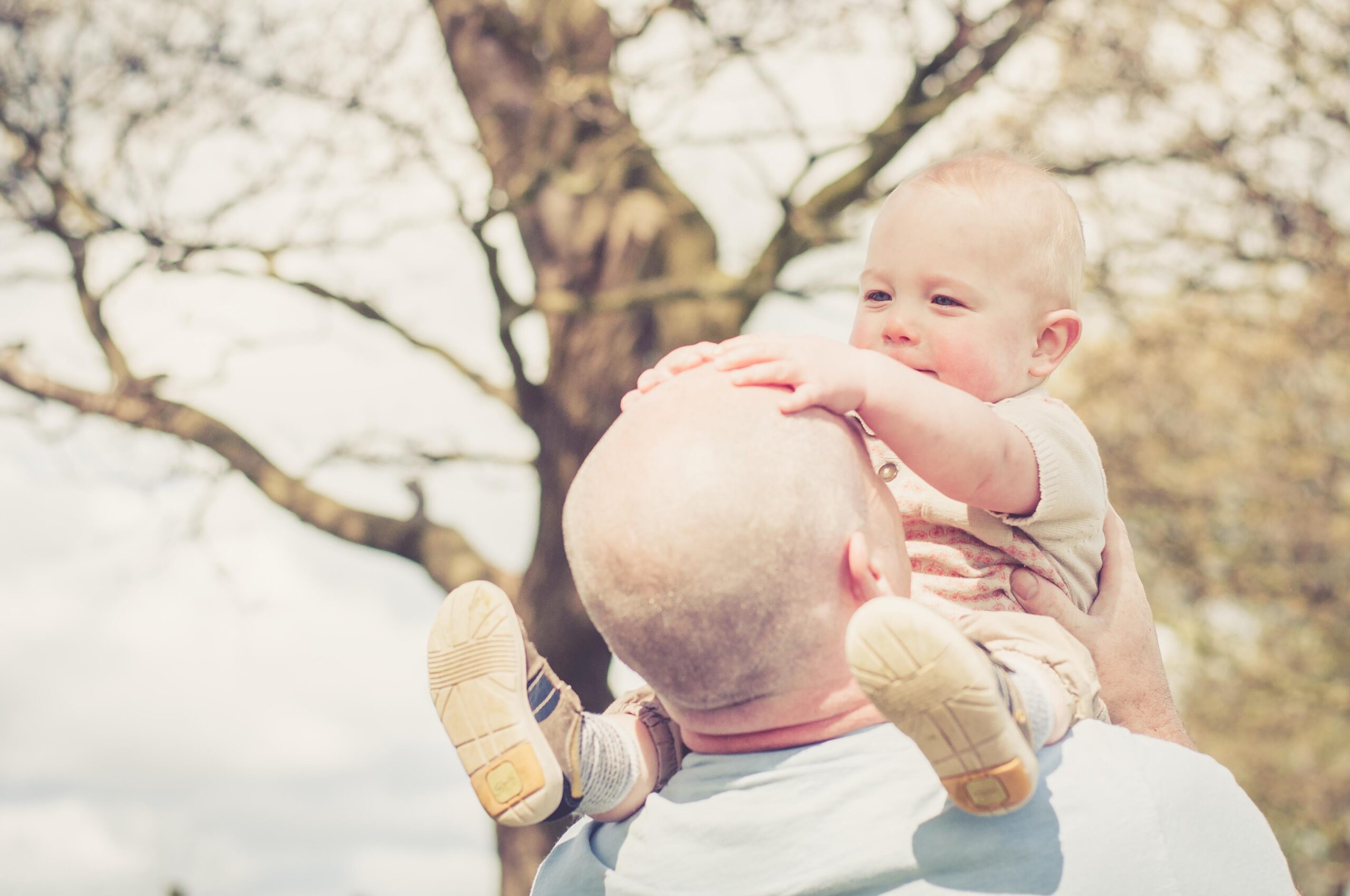 child patting Dads head