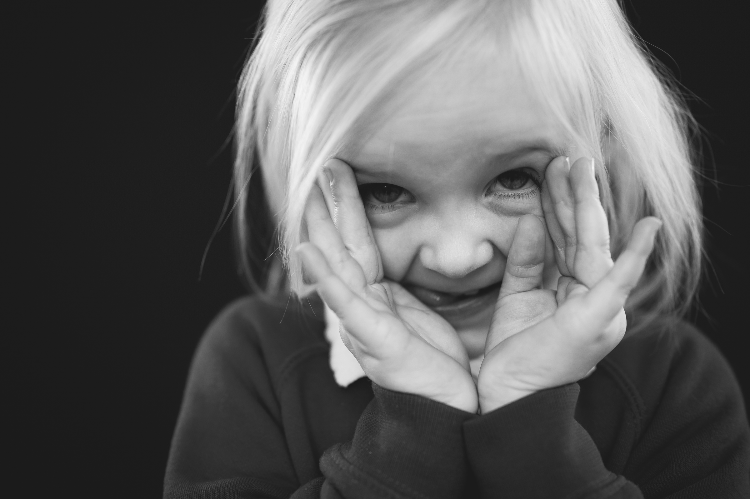 Fine art portrait of girl doing a peekaboo