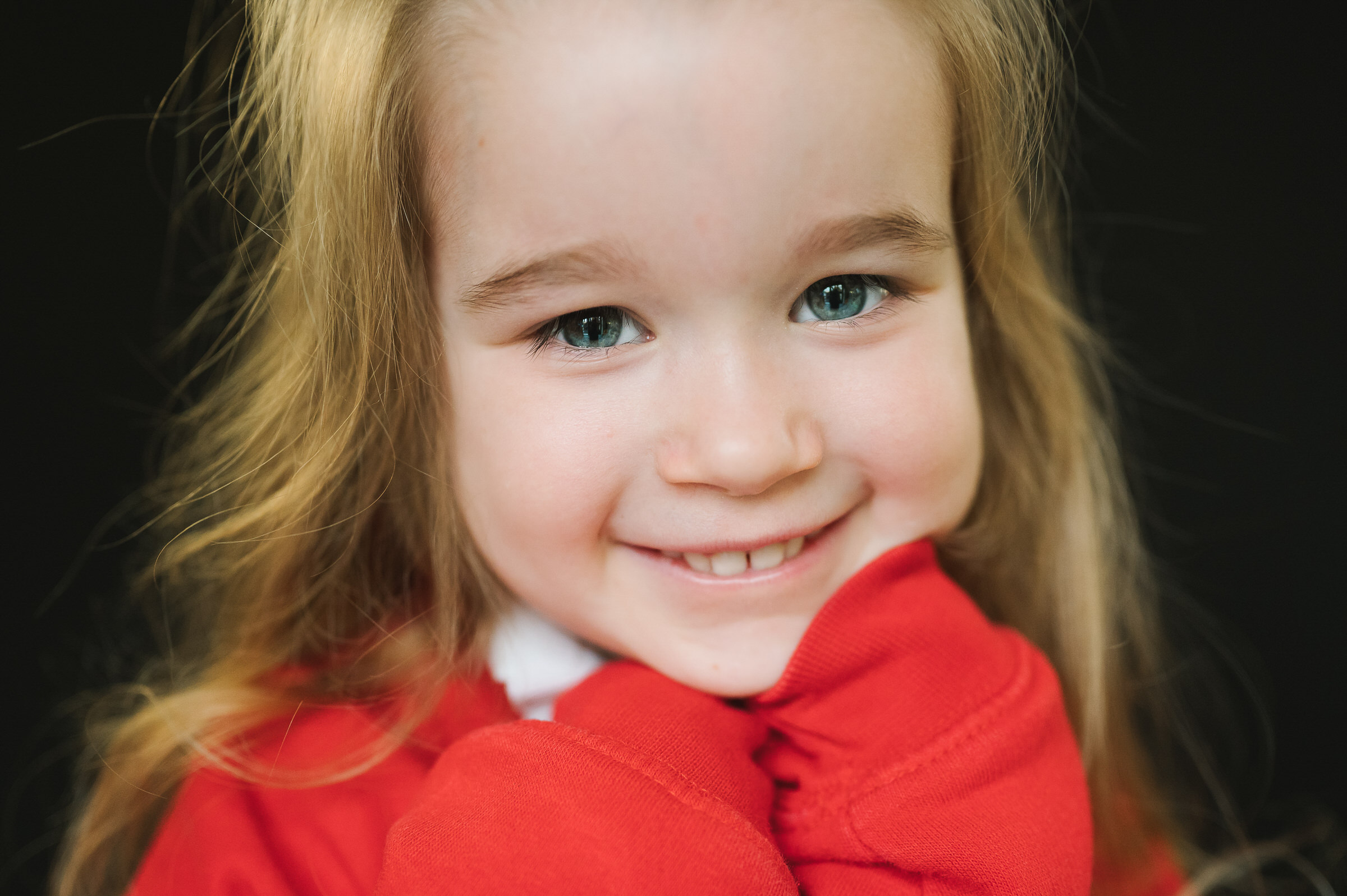 Fine art portrait of girl smiling at the camera