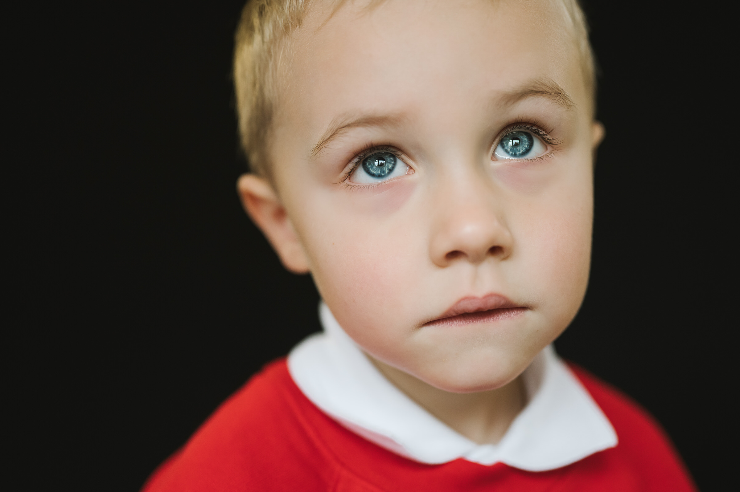 School portrait of boy deep in thought