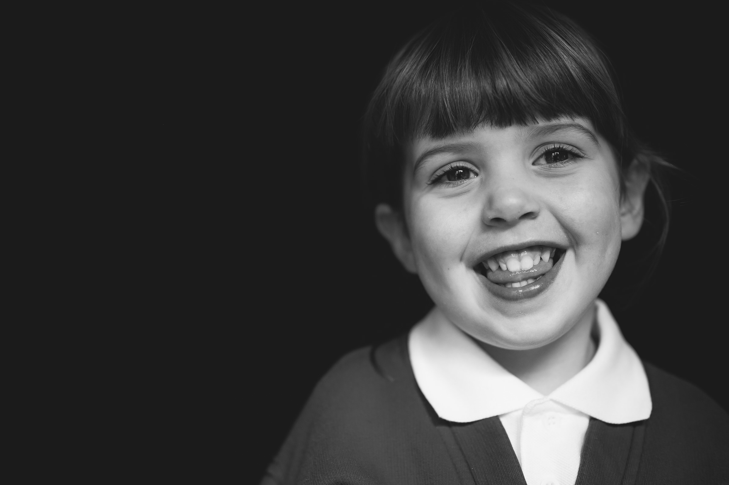 Fine art portrait of girl biting her tongue
