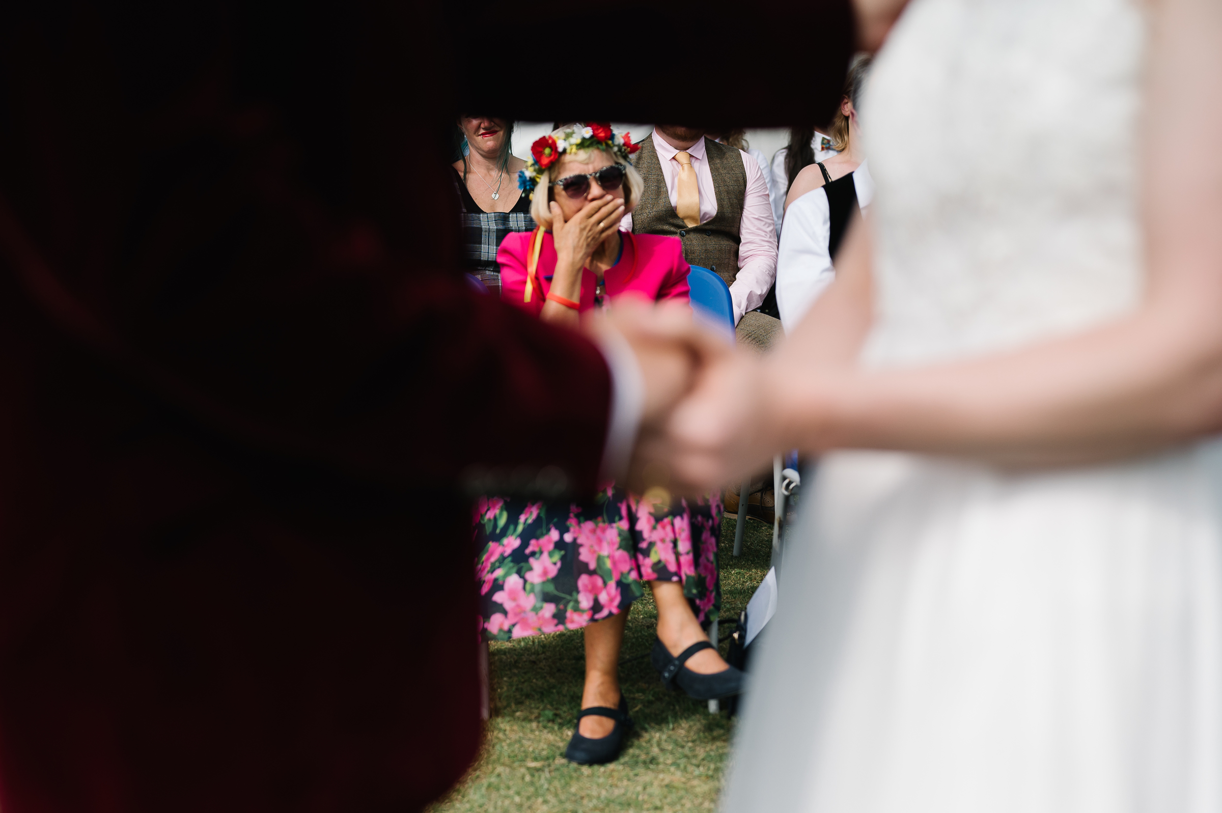 mum crying at festival wedding