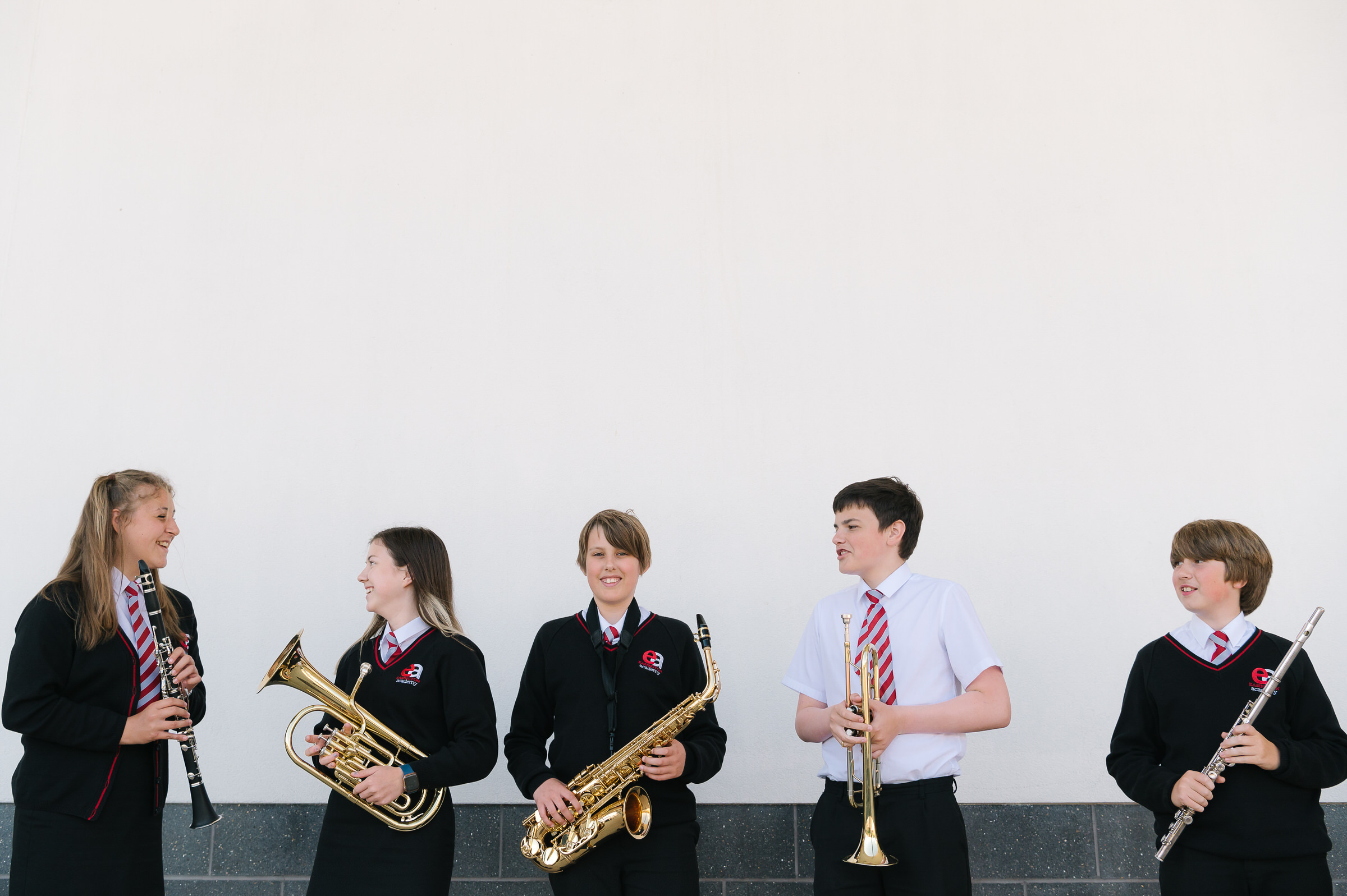 children showcasing musical instruments