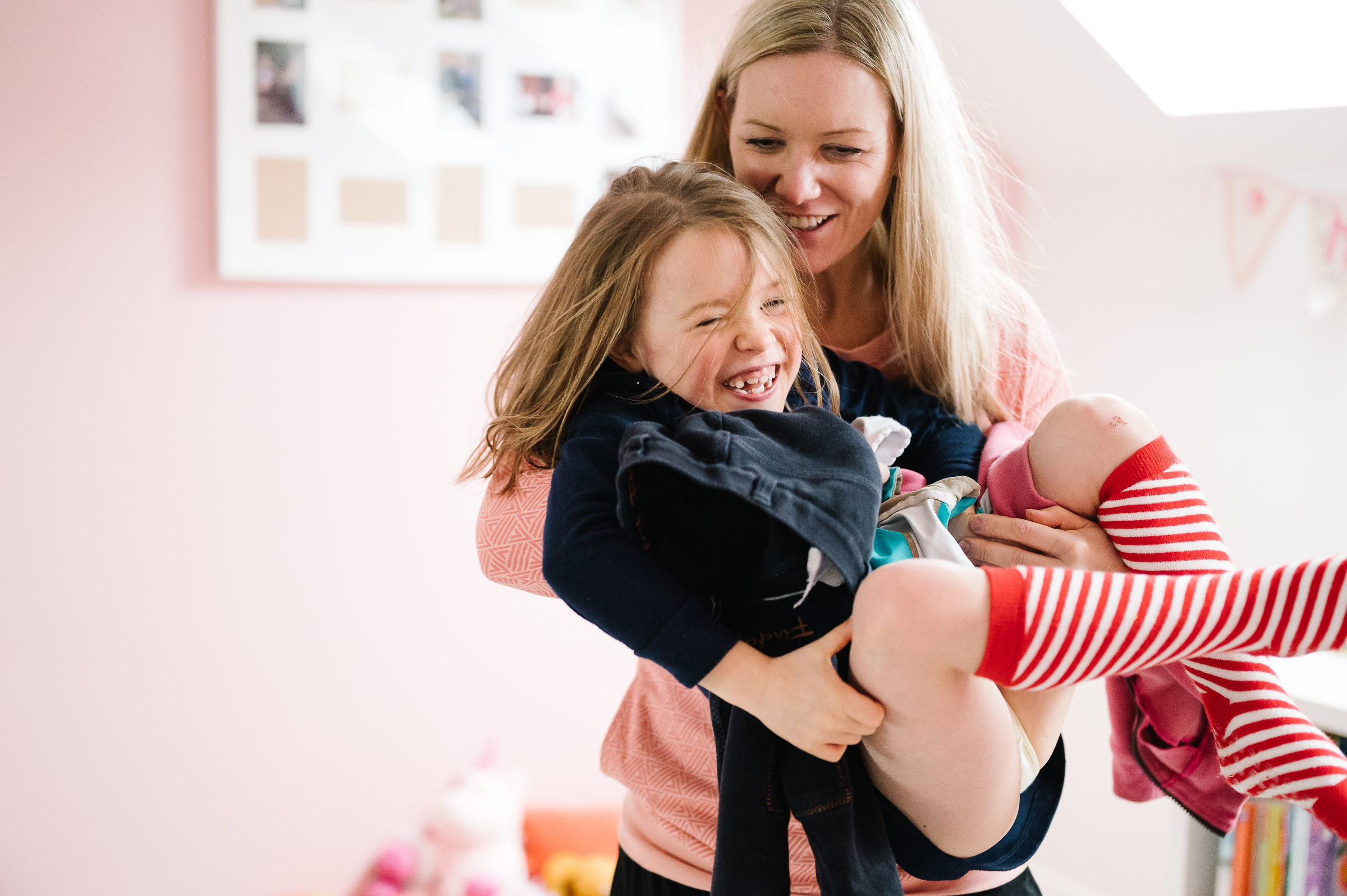 Mum carrying daughter and strippy socks