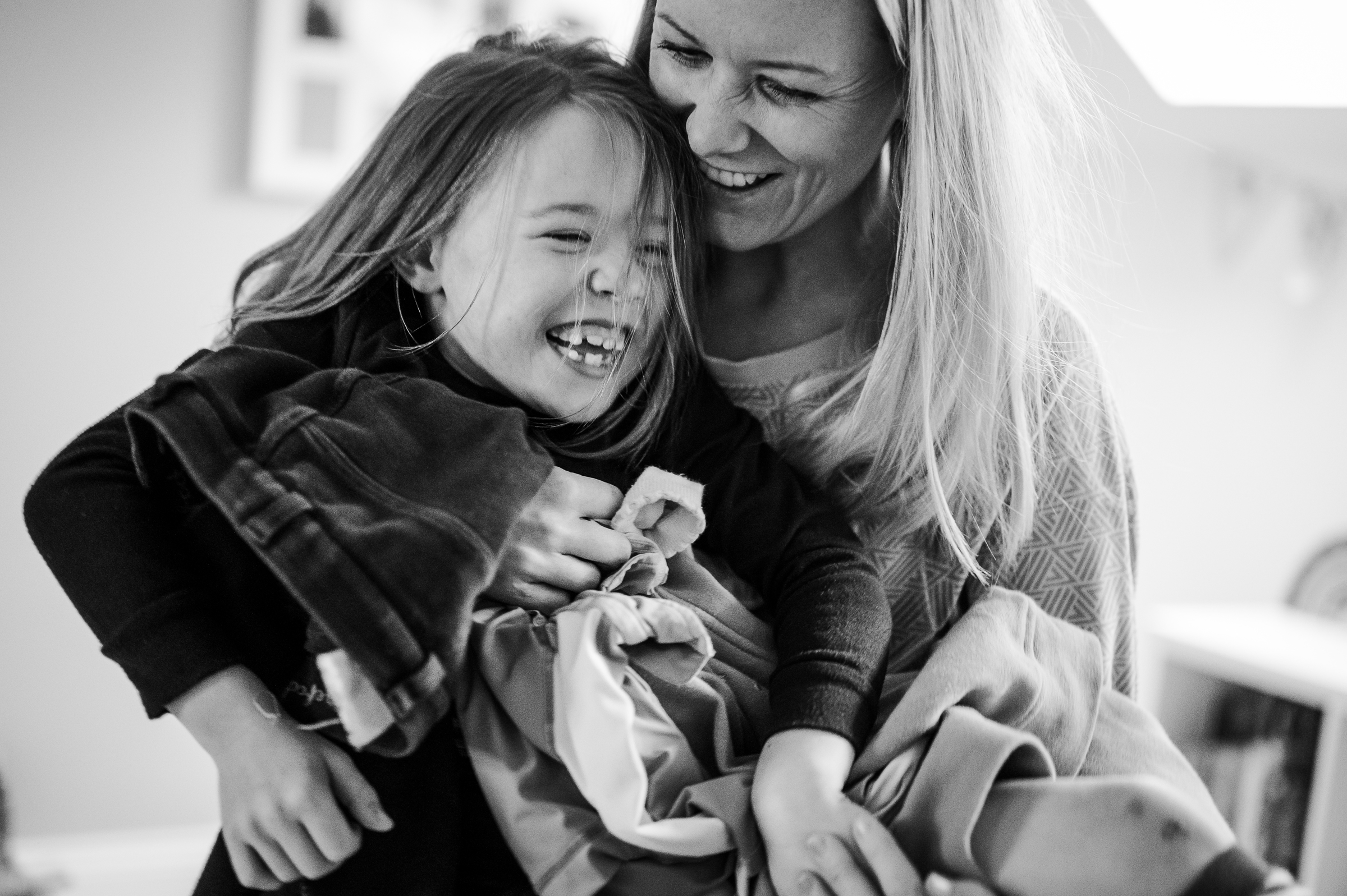 Mum tickling Daughter