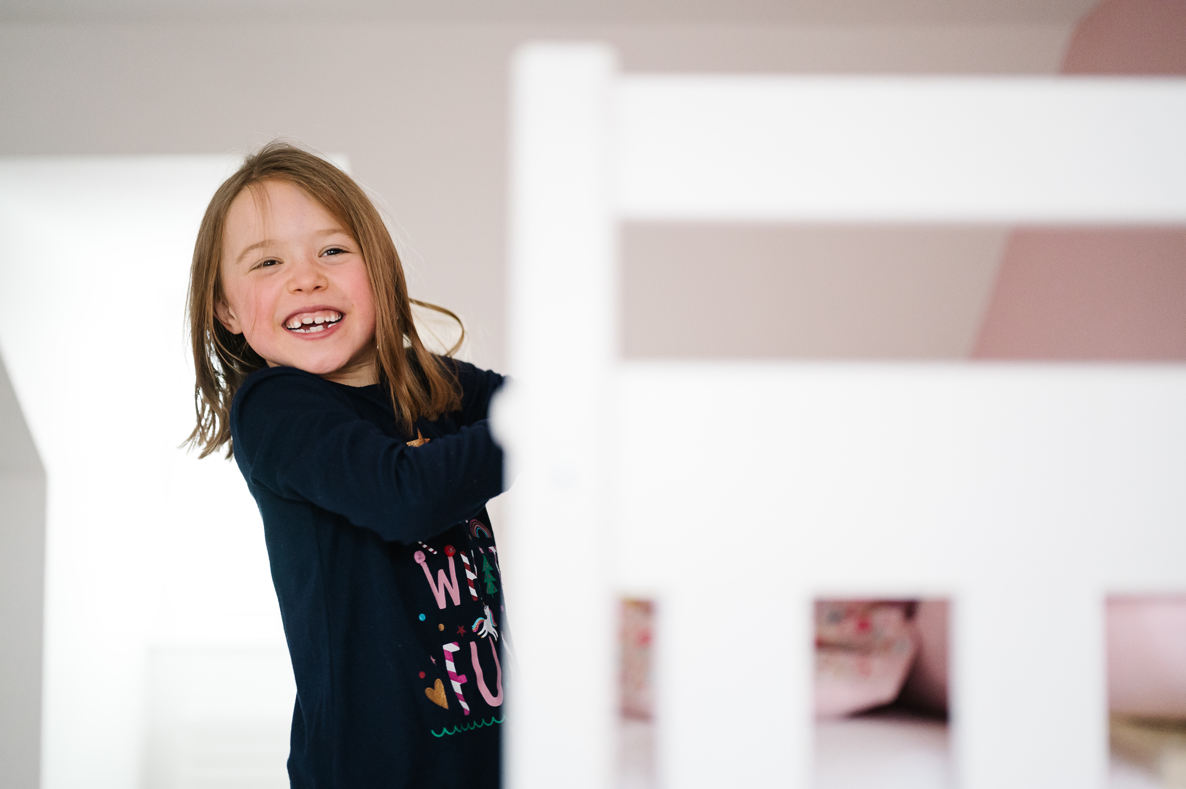 Girl hanging from bunkbed