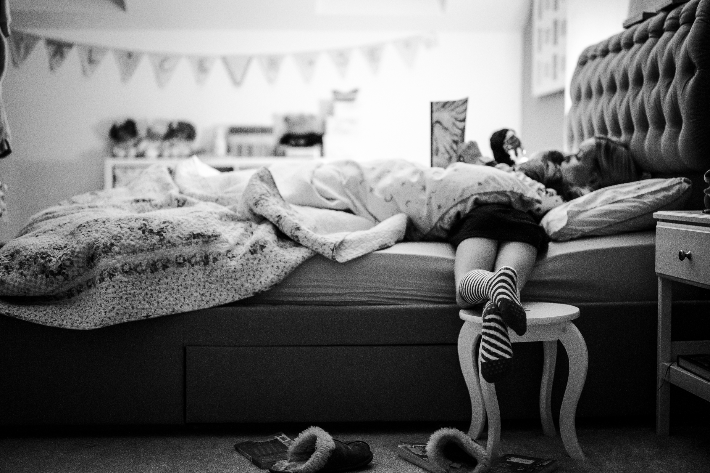 Kids lounging on bed